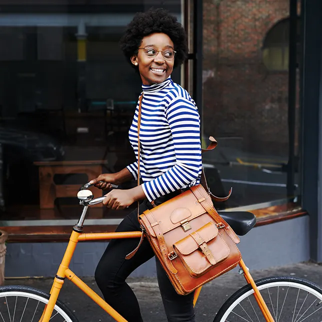 young woman on a riding a yellow bike