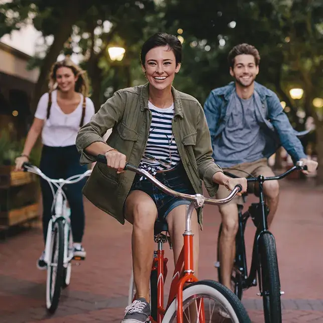 group of young adults riding bikes