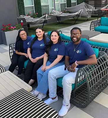 group of young adults wearing GMH shirts