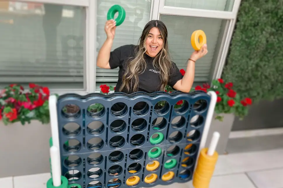Young woman playing connect four